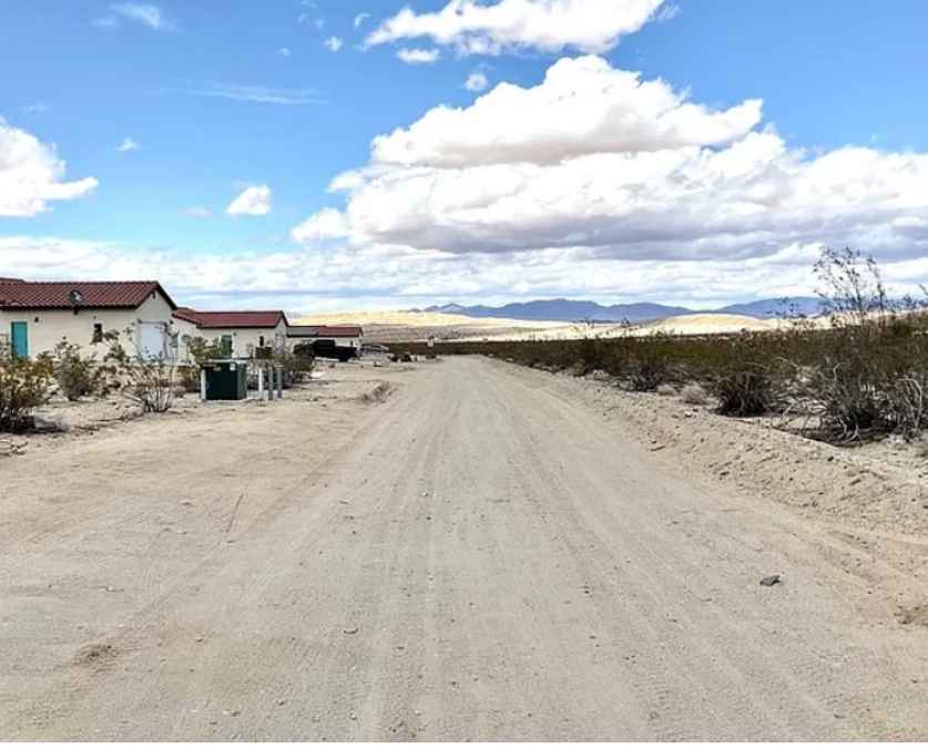 6986 Park Ave, Twentynine Palms as it is today: a vacant lot beside a dirt road